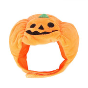 Orange plush Halloween pumpkin hat for pets with jack-o-lantern face and green stem, fits cats and dogs comfortably